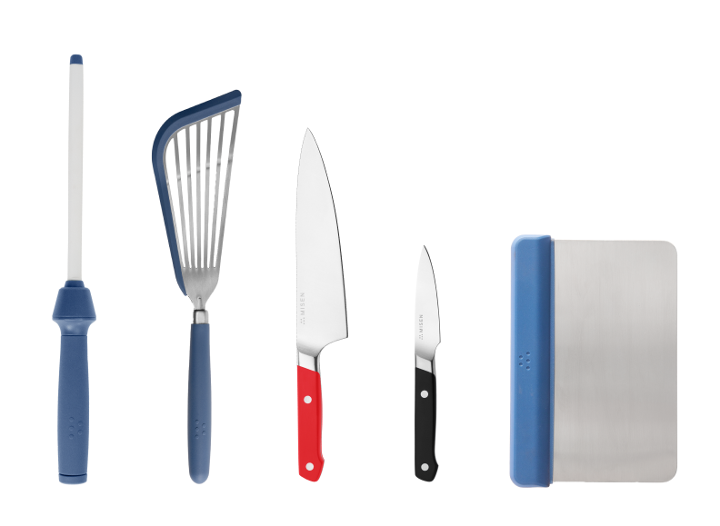 The Cheffy Kit features a honing rod, blue nonstick fish spatula, red chef's knife, black paring knife and a blue bench scraper