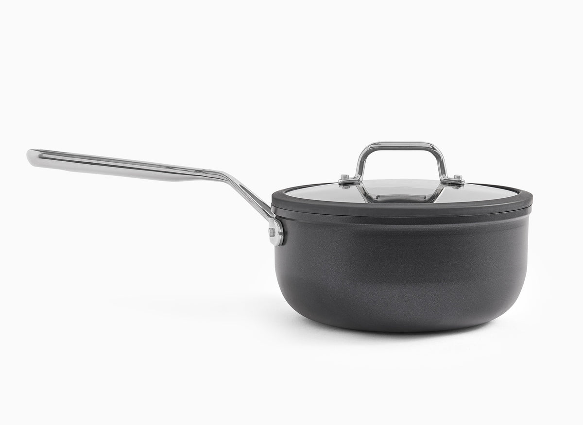 A side view of the Misen 3 QT Nonstick Saucier, with lid on, on a white background.