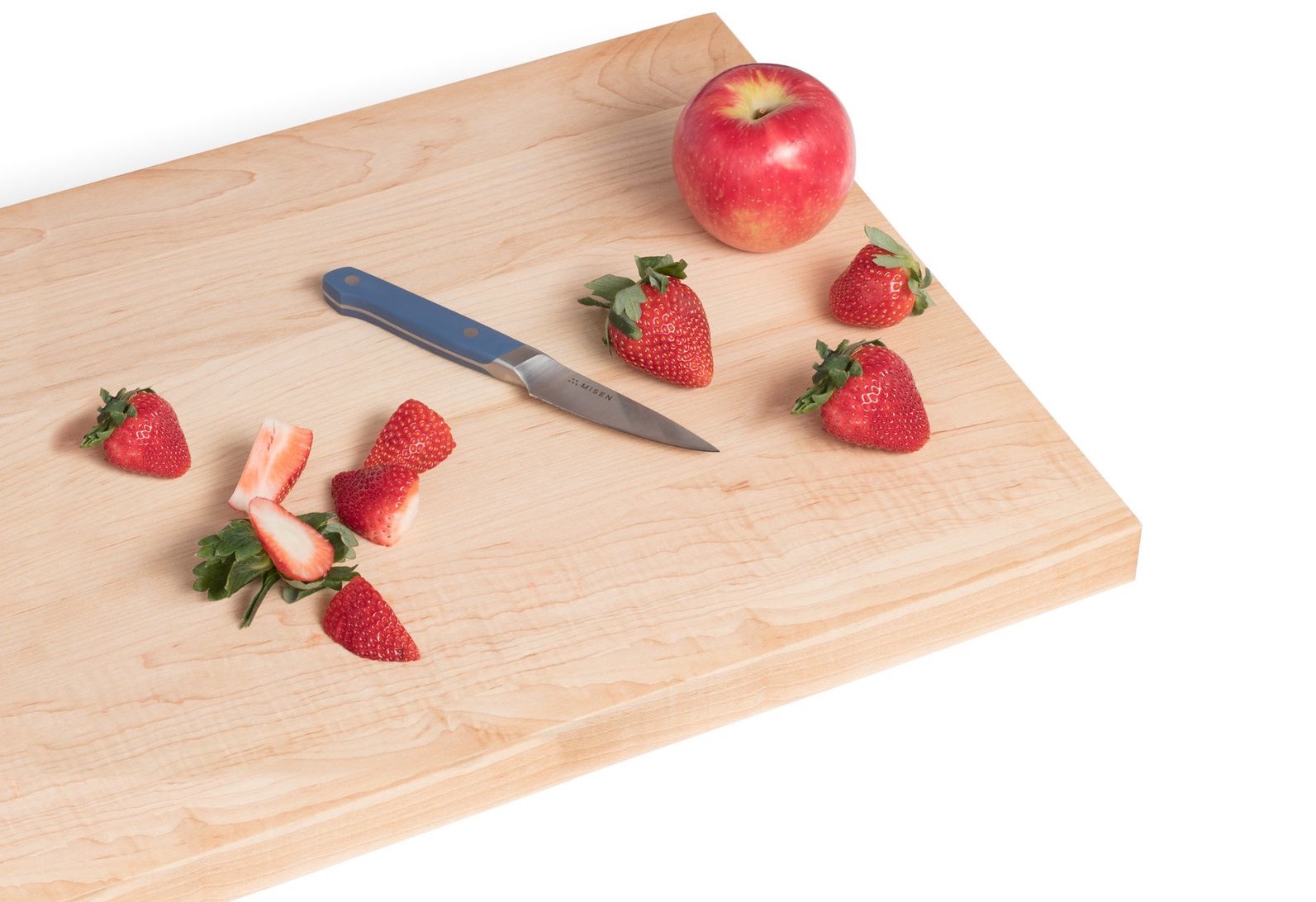 Paring knives: a Misen paring knife on a cutting board with strawberries