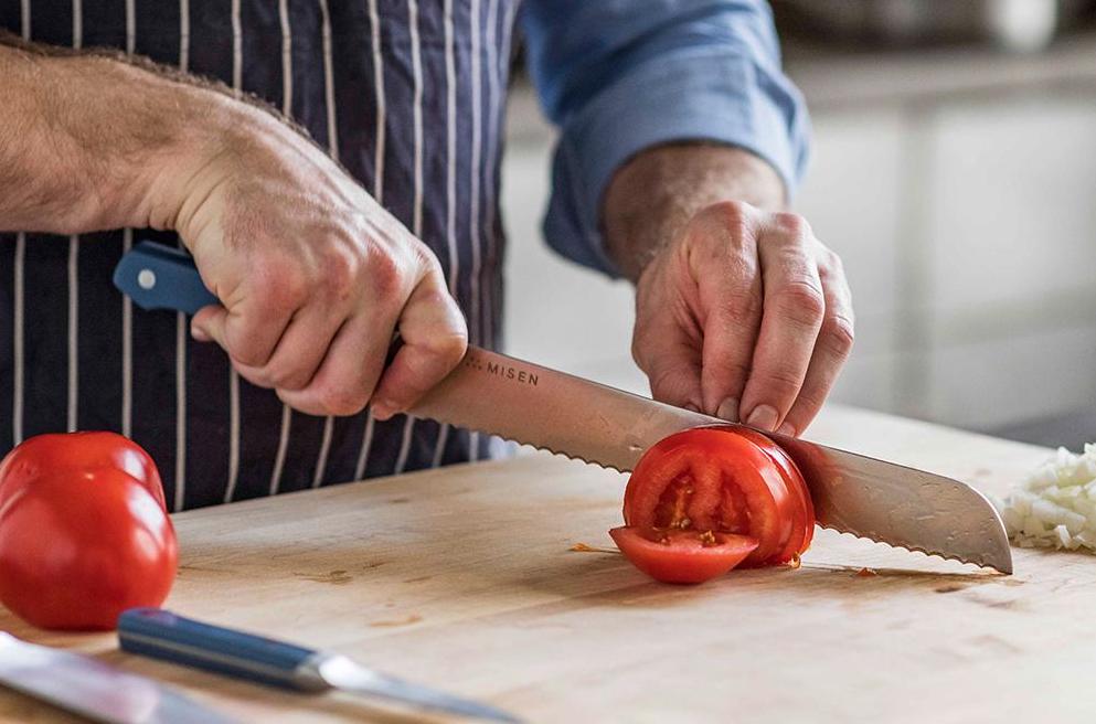 Batonnet cut: A cook slices a tomato