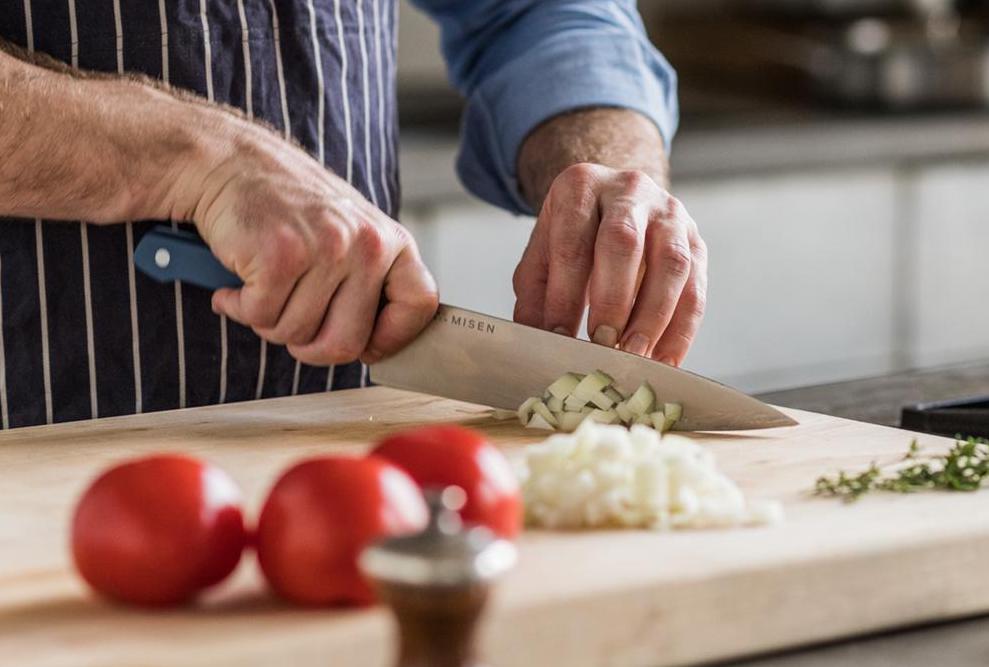 Chopped vs. diced: A chef chops an onion