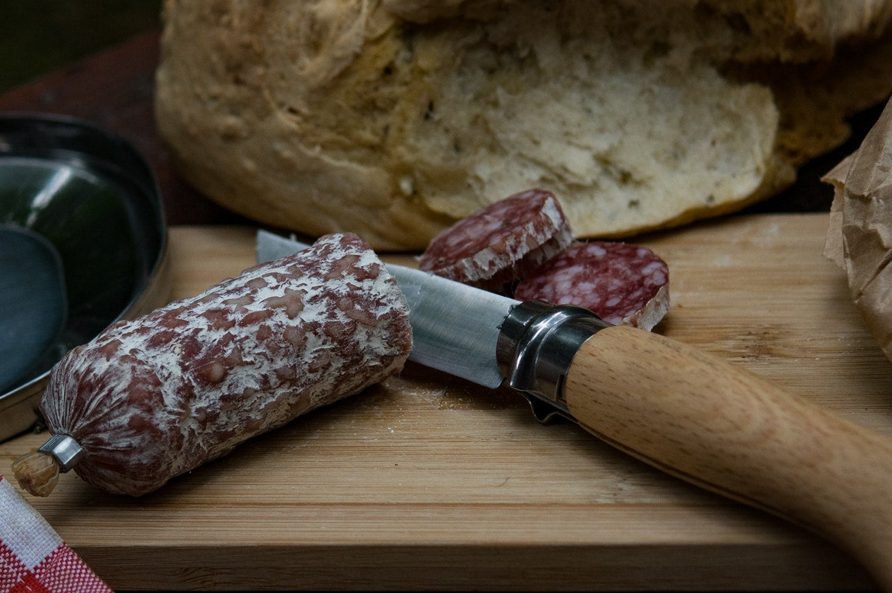 German knives: a paring knife and salami