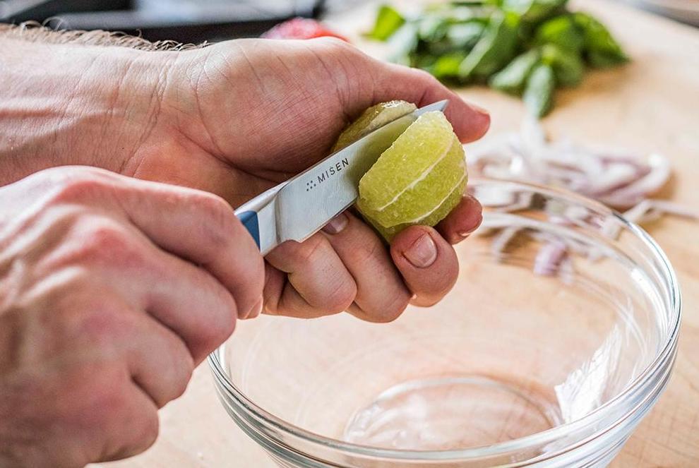 Paring knife: the Misen paring knife being used to supreme a lime