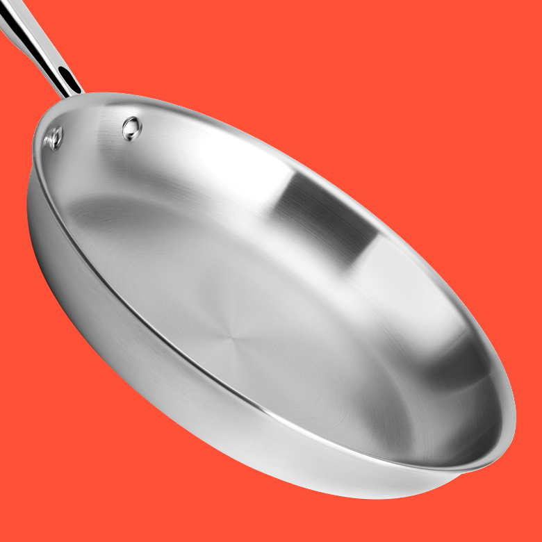 Stainless steel frying pan with riveted handle, polished interior