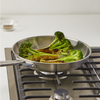 Charring broccoli in a Misen Stainless Steel Skillet