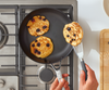 Flipping pancakes in a Misen Nonstick Pan with a gray, nonstick-safe Fish Spatula