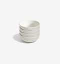 4-piece white cereal bowl set on a white table