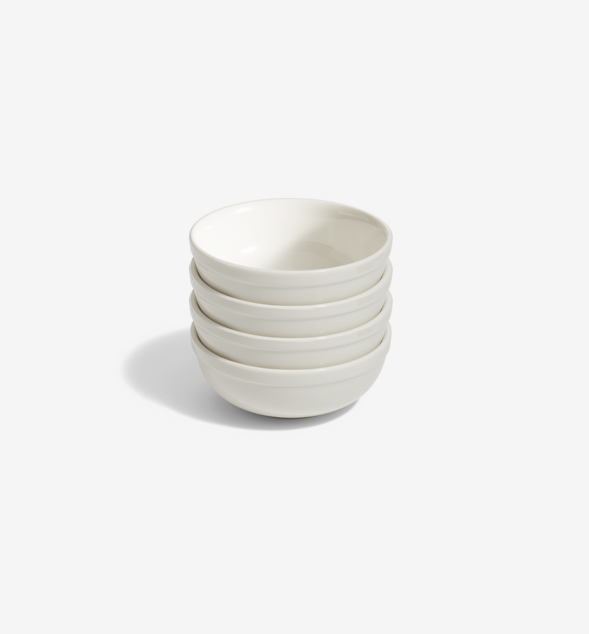 4-piece white cereal bowl set on a white table