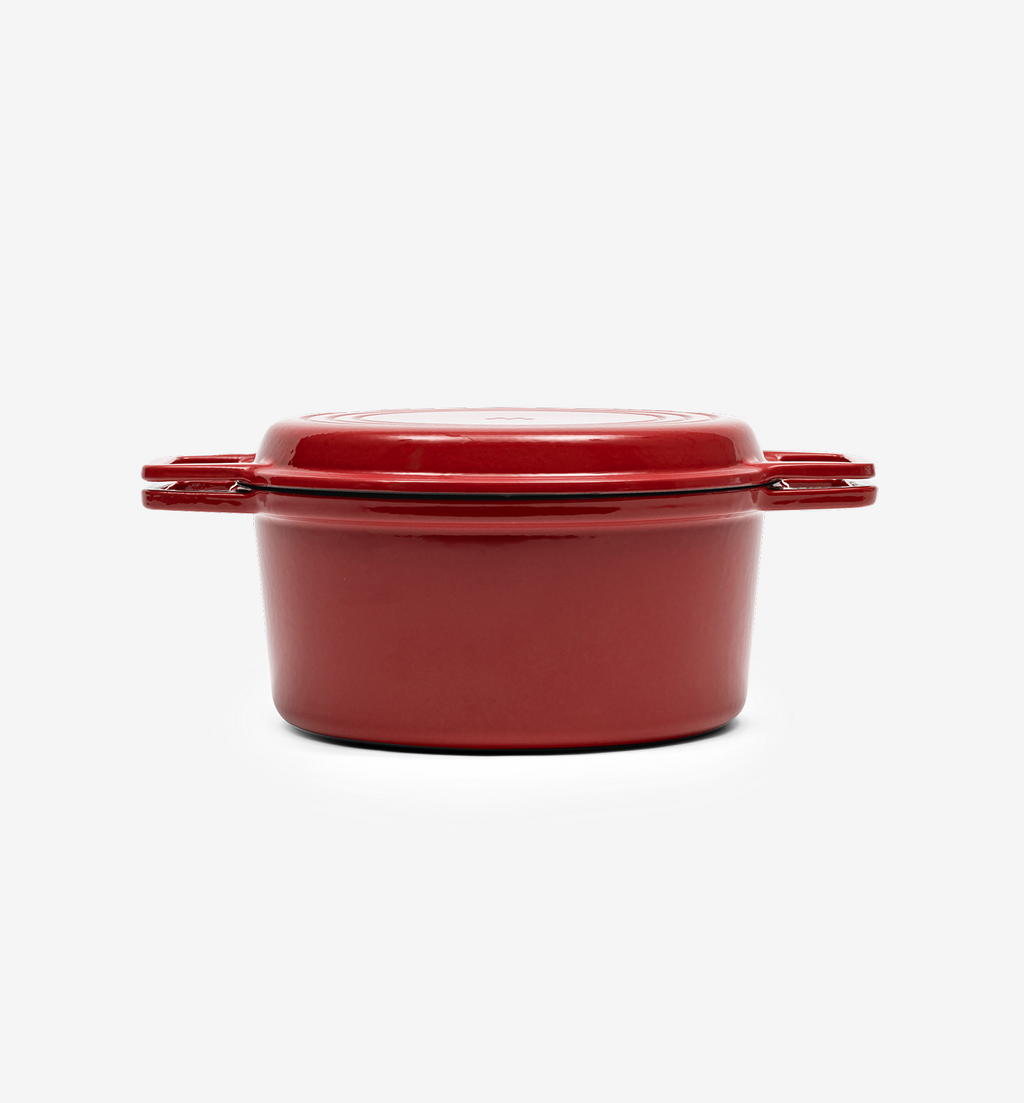 Red enameled cast iron Dutch oven with lid and side handles