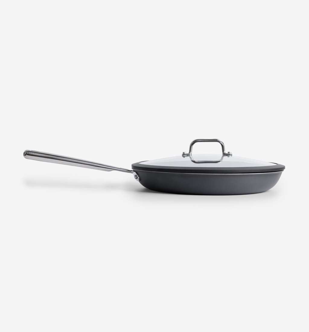 Hard-anodized nonstick frying pan with glass lid and stainless steel handle