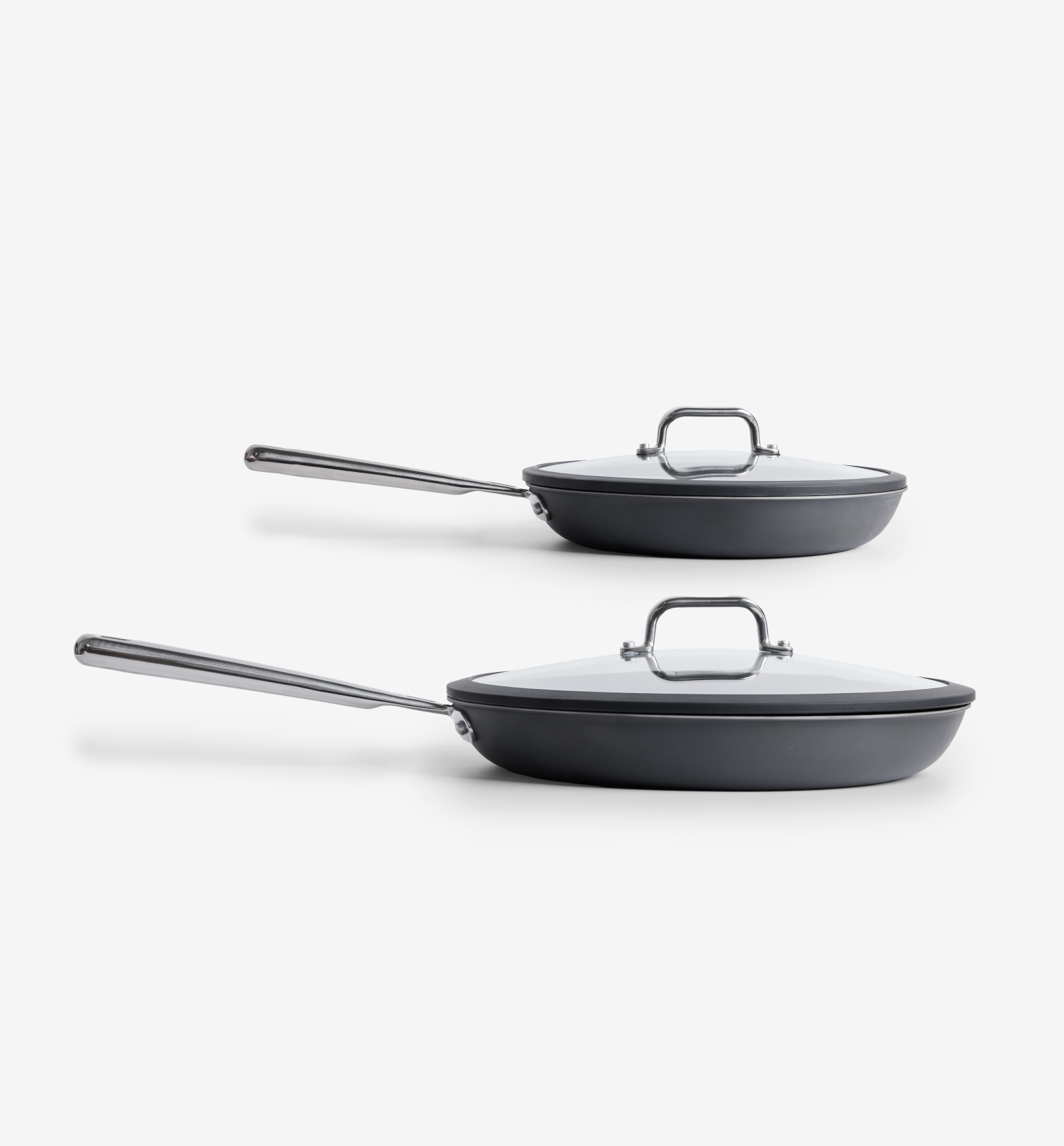 Hard-anodized nonstick frying pans set with glass lids and stainless steel handles
