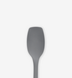 Gray silicone spatula head close-up with flexible wide blade