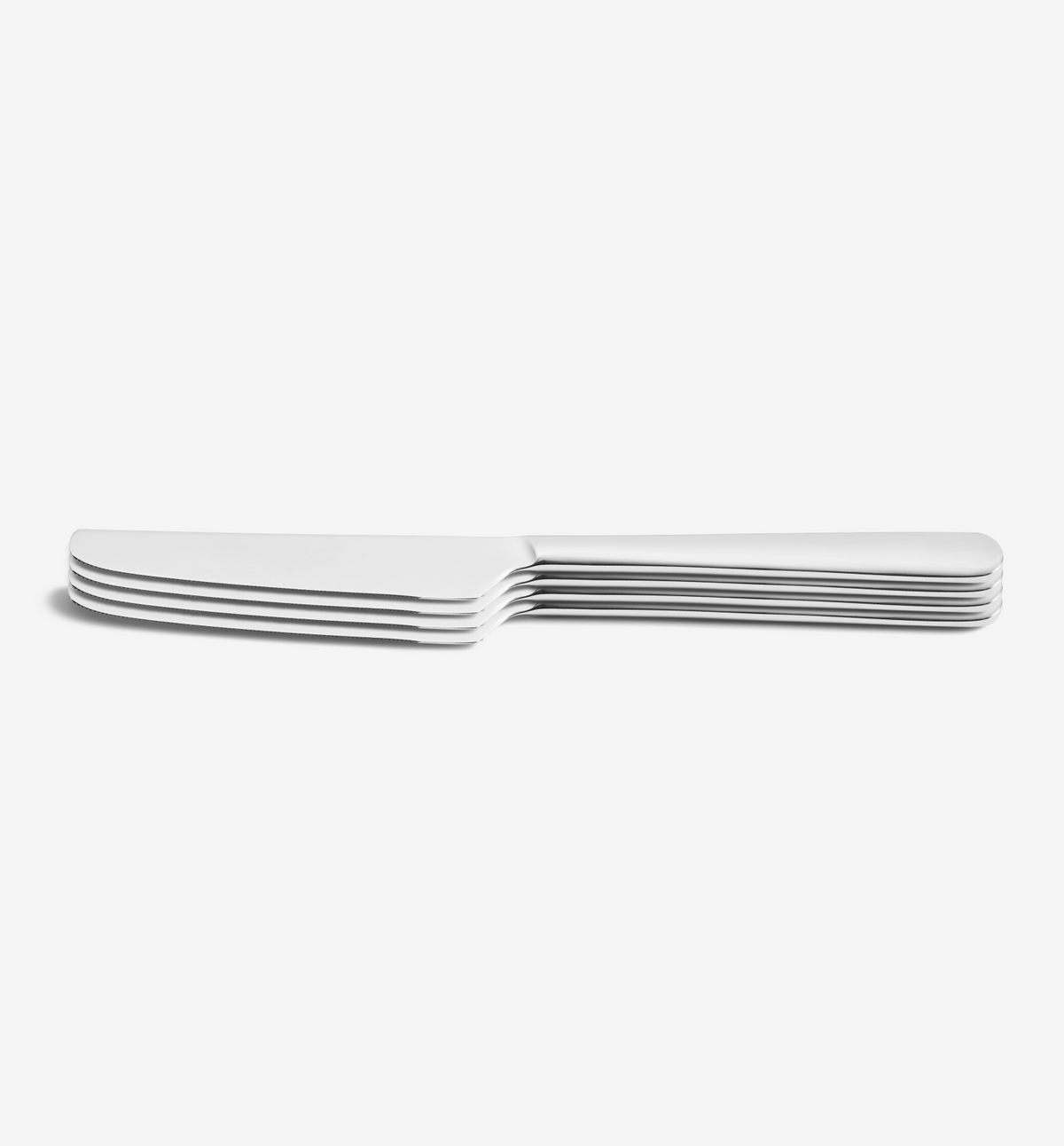 Polished 4-piece dinner knife set on white background