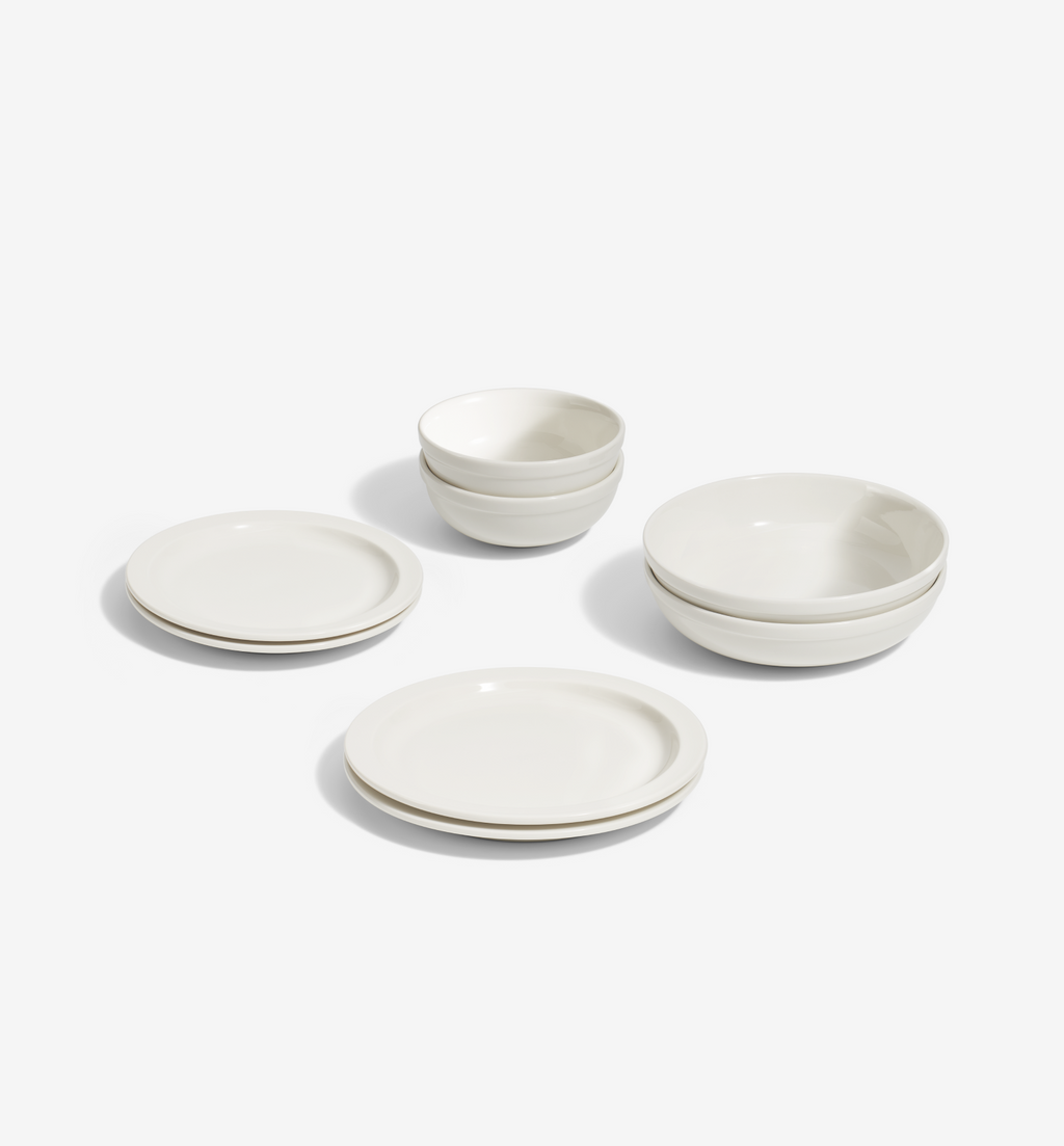 8-Piece Dinnerware Set in white porcelain with plates, salad plates, pasta bowls, and cereal bowls