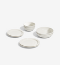 8-Piece Dinnerware Set in white porcelain with plates, salad plates, pasta bowls, and cereal bowls