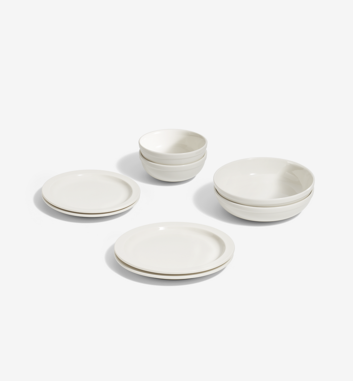 8-Piece Dinnerware Set in white porcelain with plates, salad plates, pasta bowls, and cereal bowls