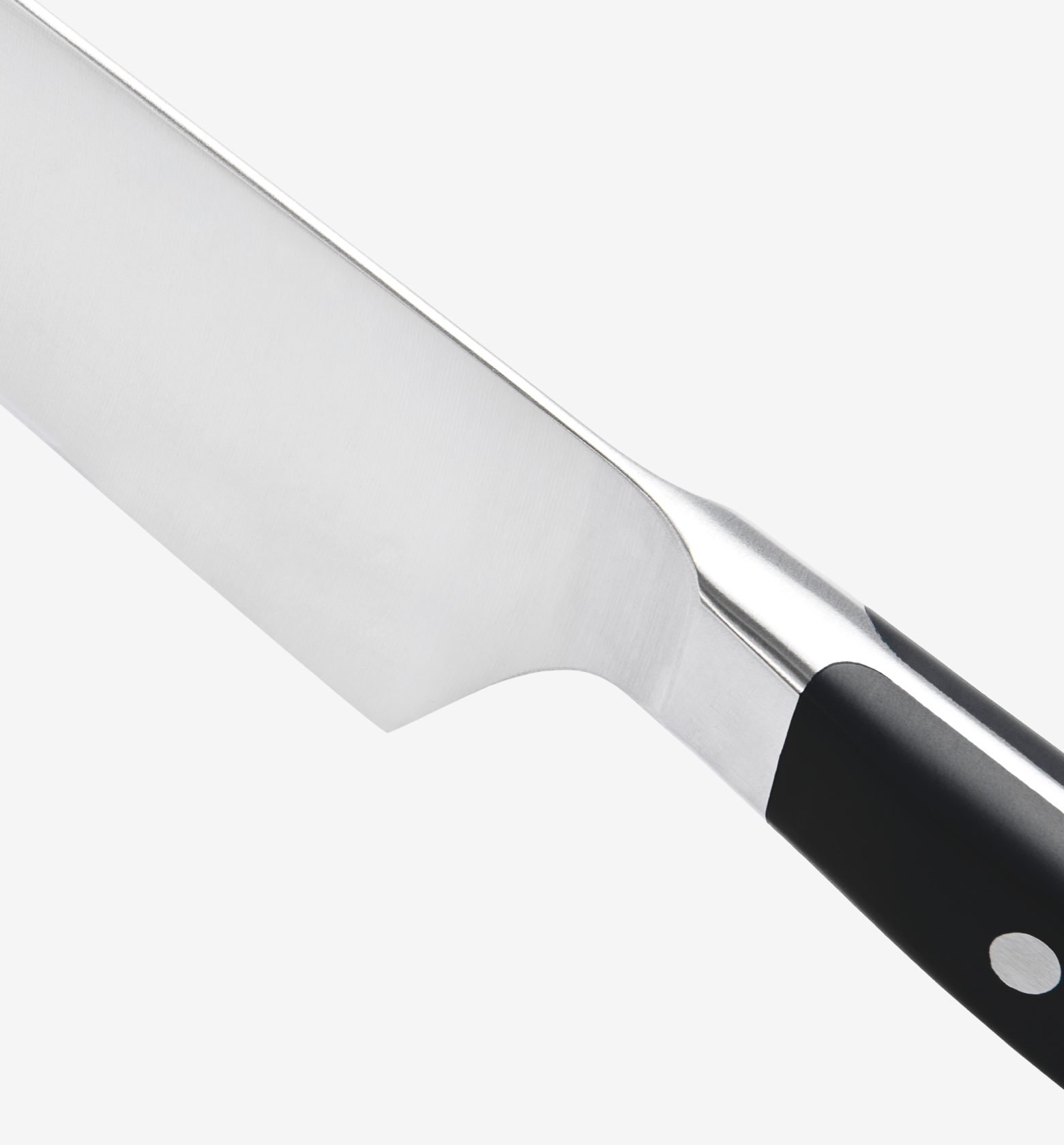 Chef's knife close-up showing stainless steel blade, bolster, and black handle with rivets