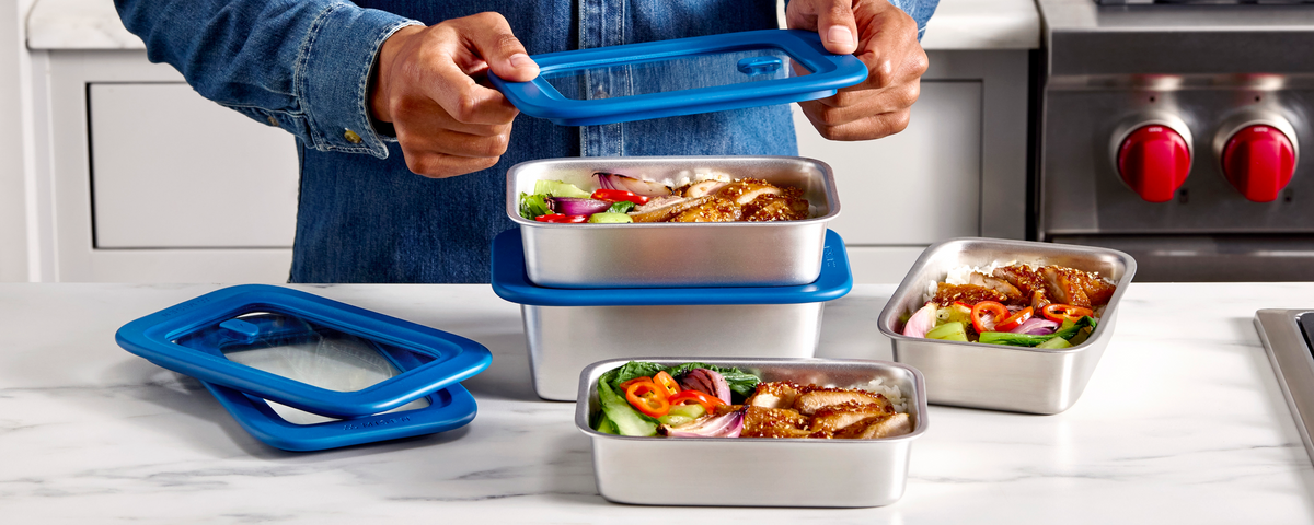 Misenware stainless steel food containers with blue lids and prepared meals