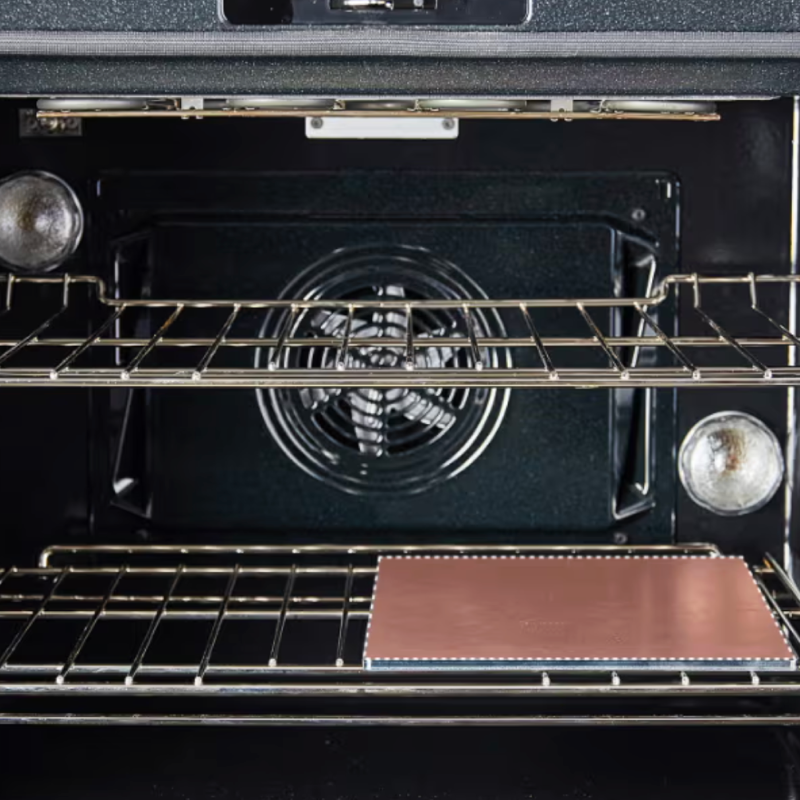 Open convection oven interior with two wire racks and baking stone on lower shelf