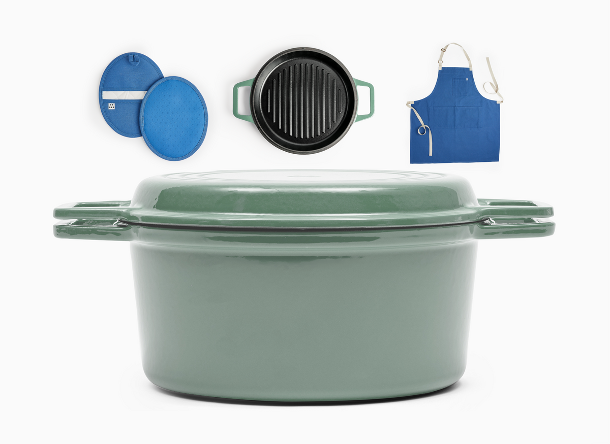 The Dutch Treat bundle contains a Grill Dutch Oven (without a silicone lid) in Sage green and also comes with a set of blue pot holders and a blue apron