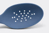 A close view from the front of a Blue Misen Slotted Spoon’s head with drainage holes visible.