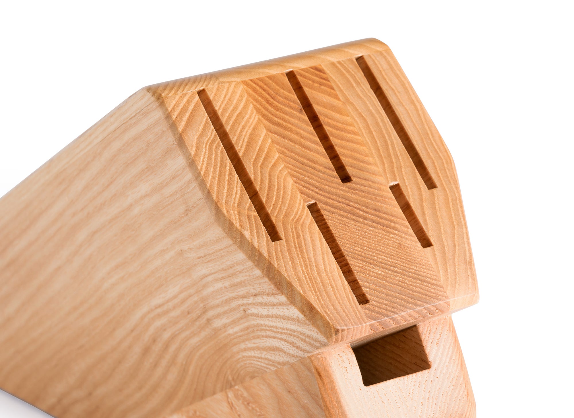 Close view of empty knife and shears slots on an Ash Misen Knife Block seen from the front.