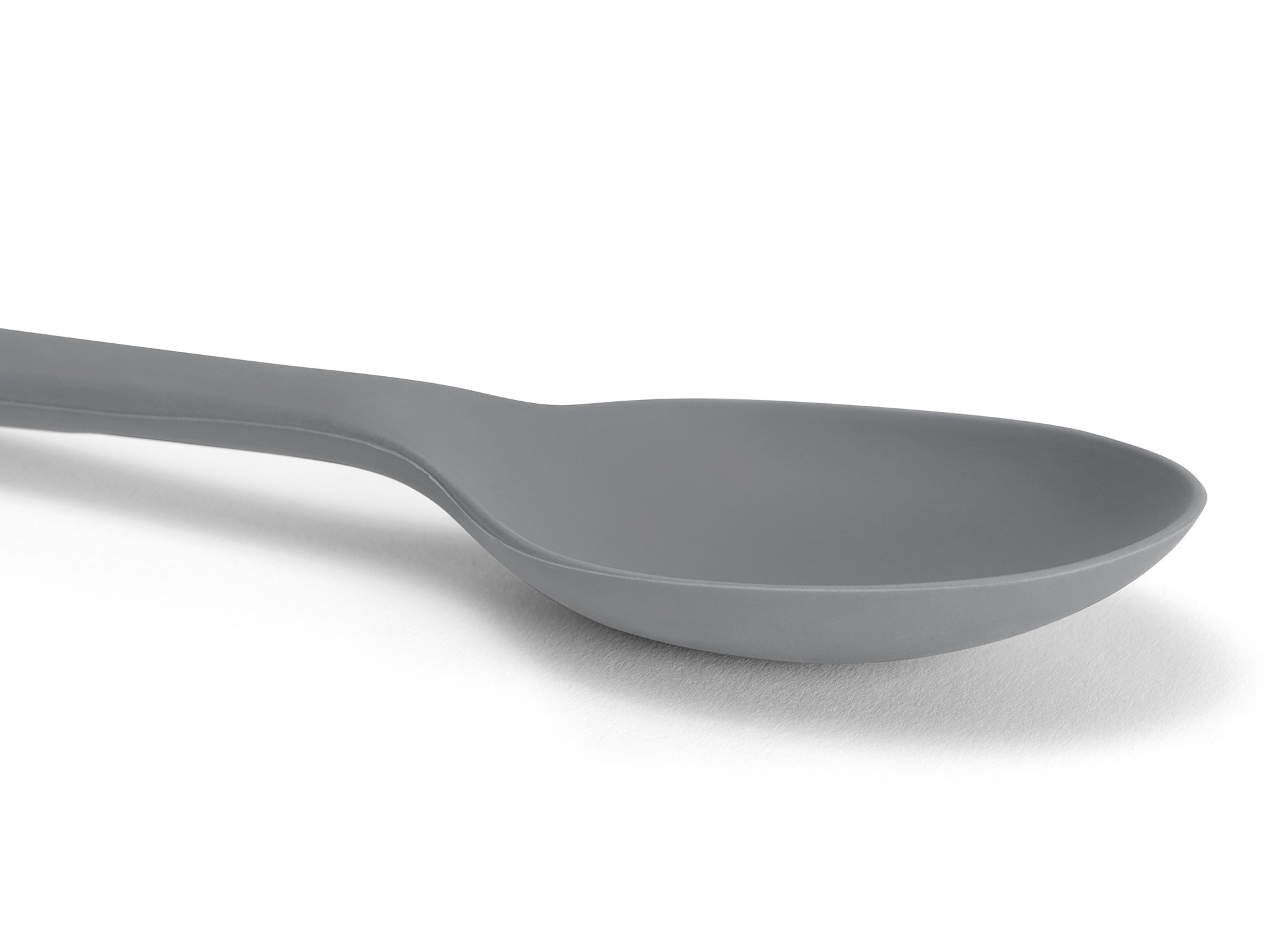 A Grey Misen Mixing Spoon seen from above on a white background.
