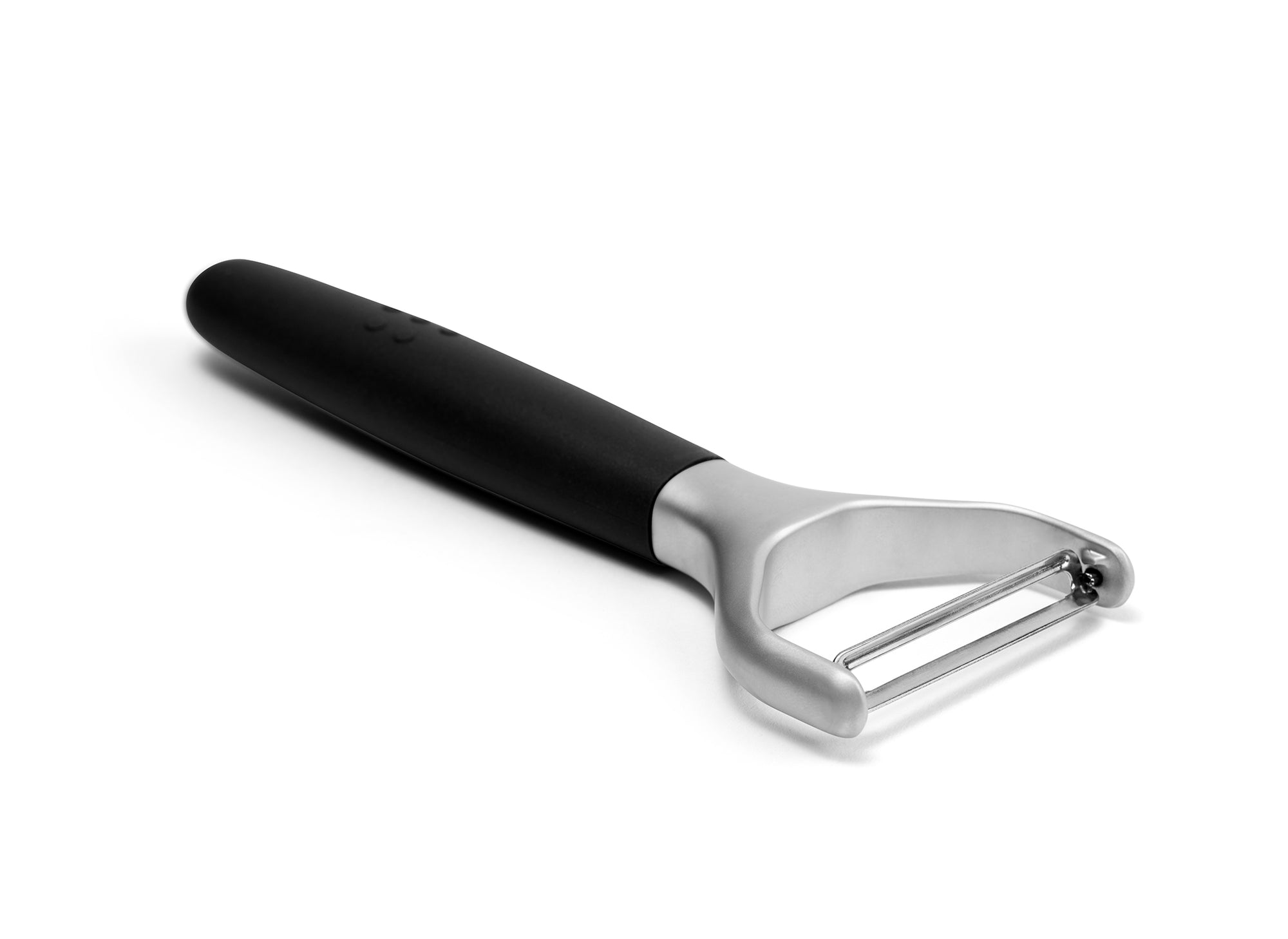 A Black Misen Peeler with silicone handle and metal Y-shaped head viewed from the side on a white background.