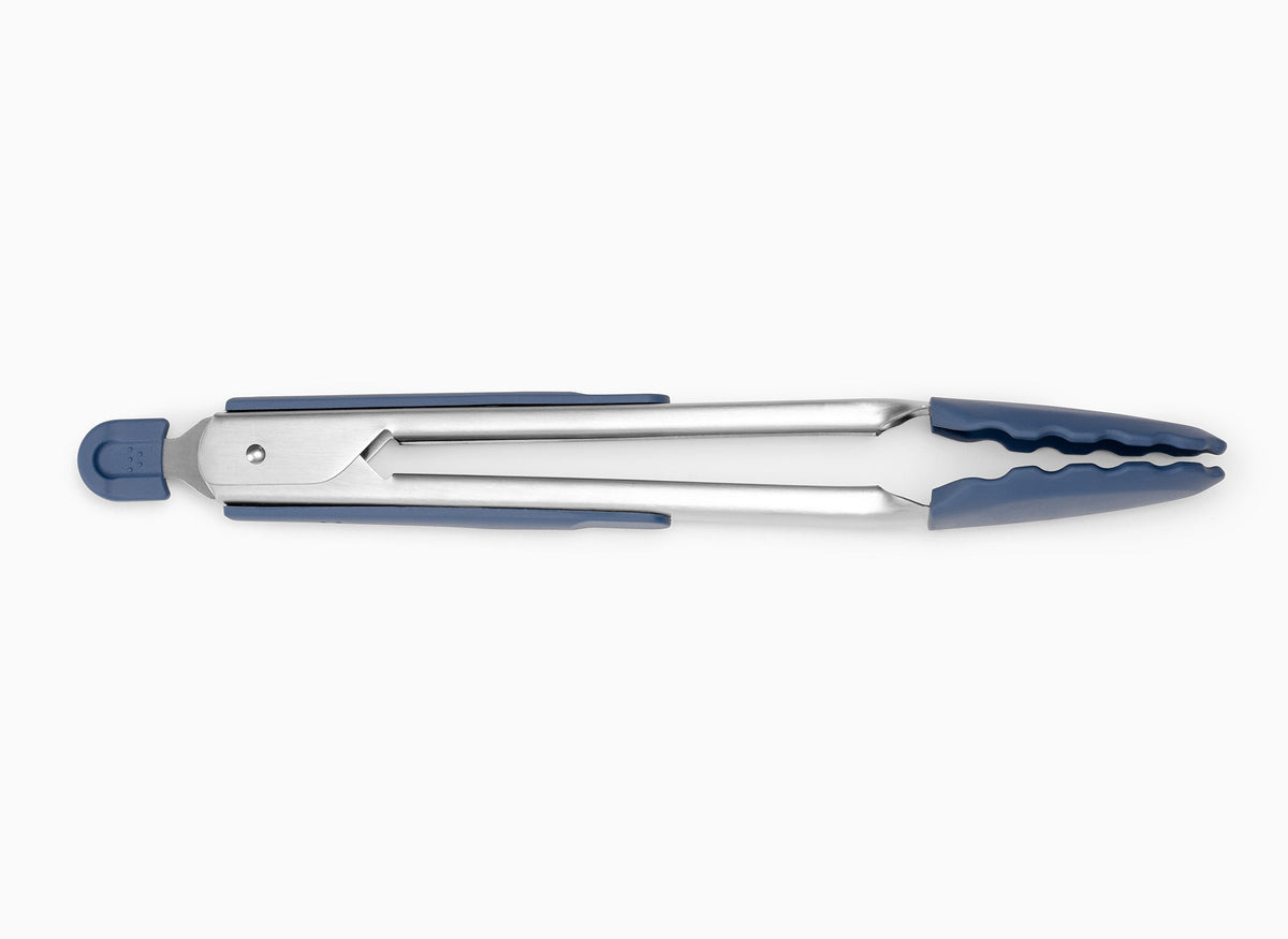 Large Blue Misen Silicone Tongs in a closed position, seen from the side on a seamless white background.