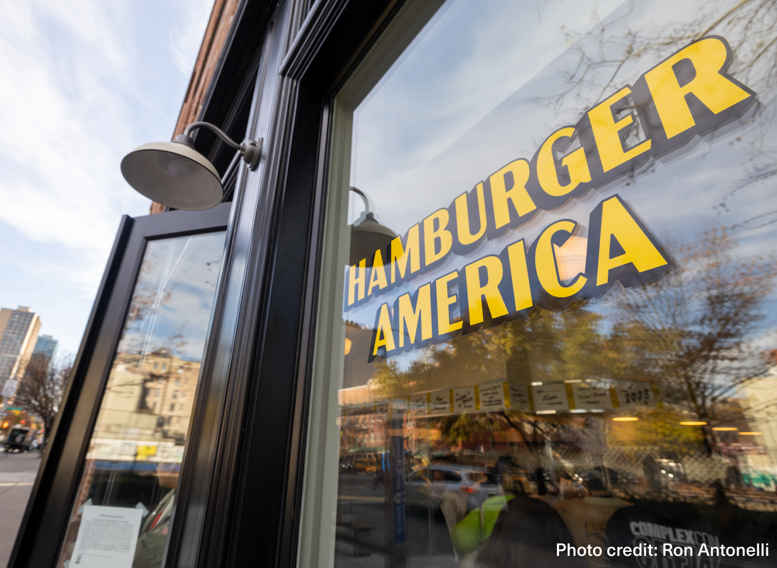 The outside window of Hamburger America, showcasing the restaurant's logo in the window. Photo credit: Ron Antonelli