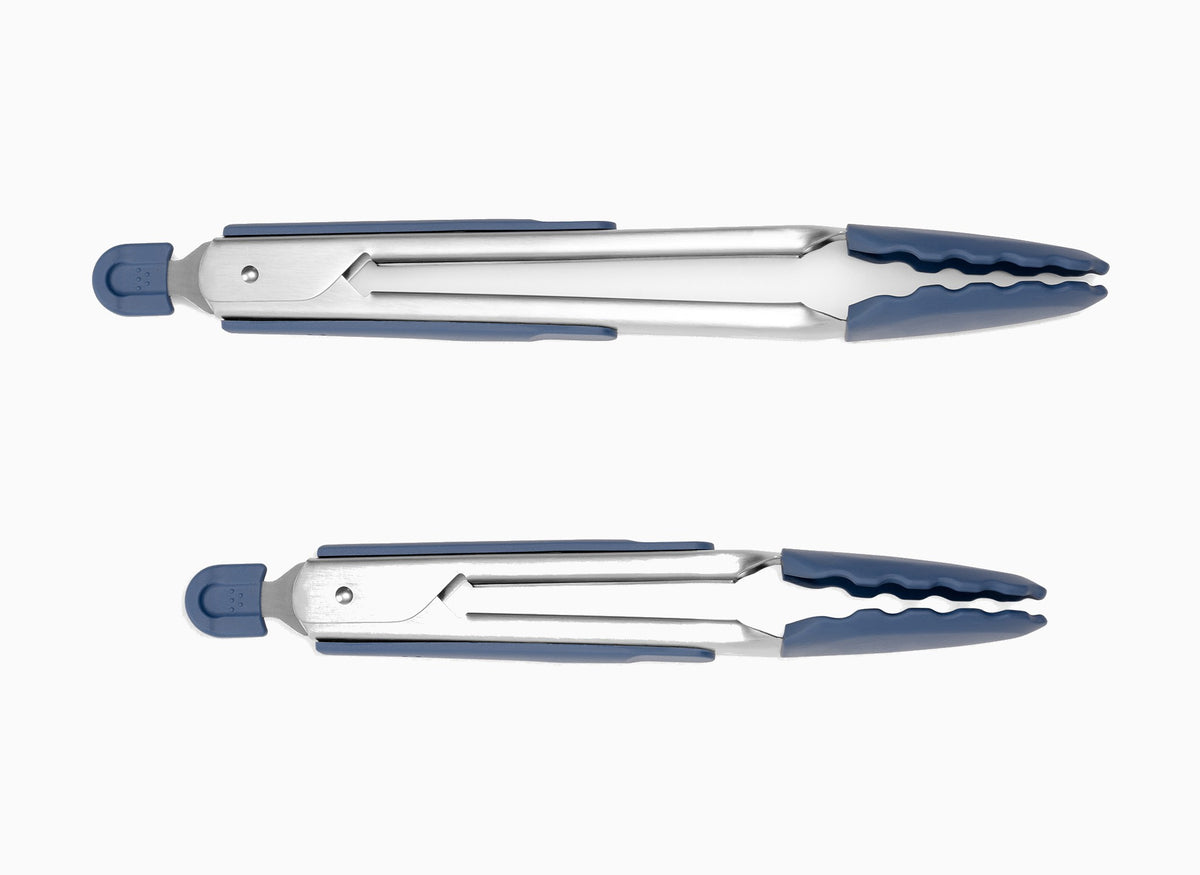 Large Blue Misen Silicone Steel Tongs and Small Blue Misen Silicone Tongs in a closed position, seen from the side on a seamless white background.