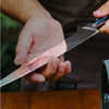 A man getting ready to sharpen a Misen Chef's Knife