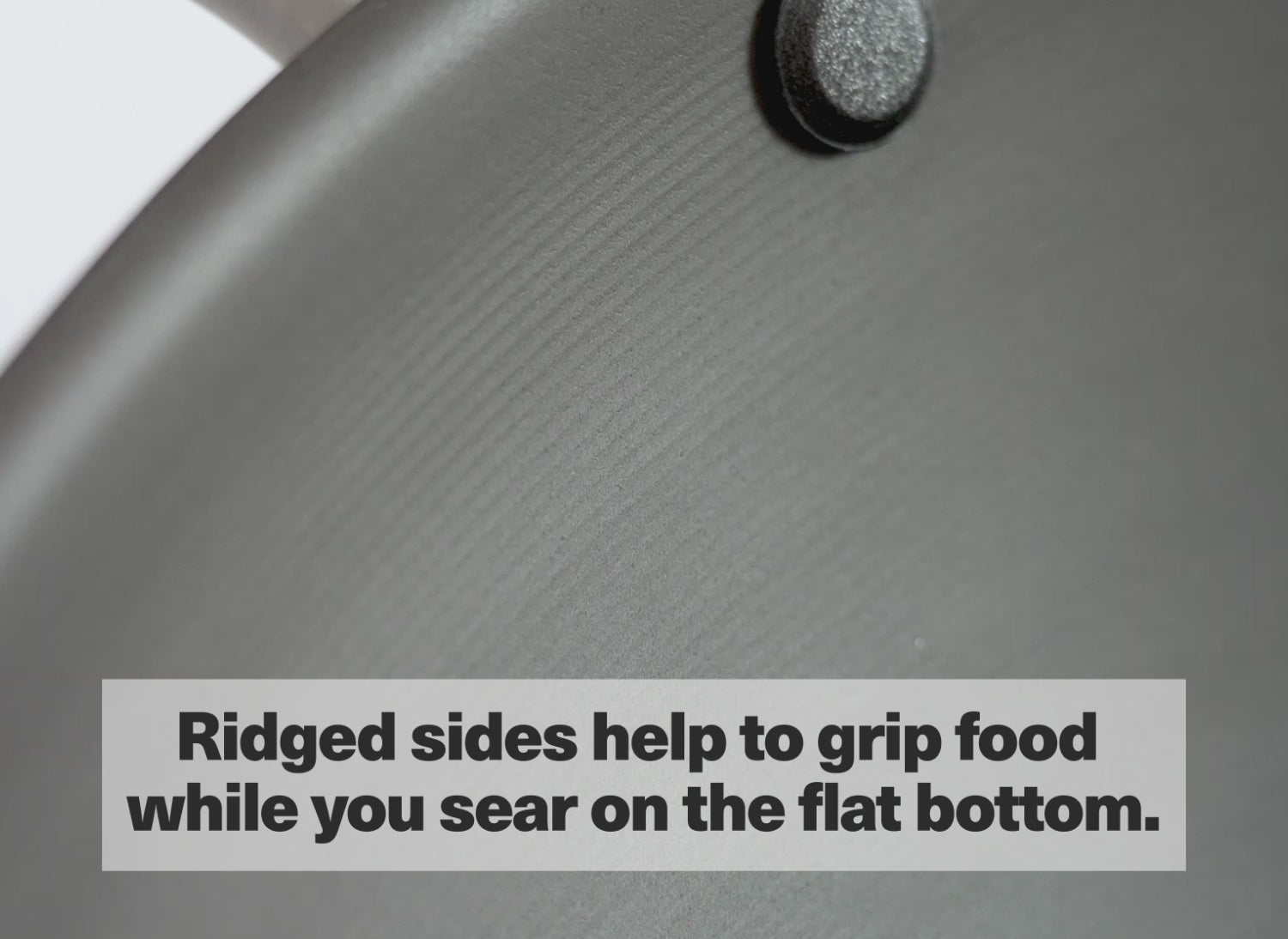 The Misen Wok has ridged sides to help grip food while you sear on the flat bottom.