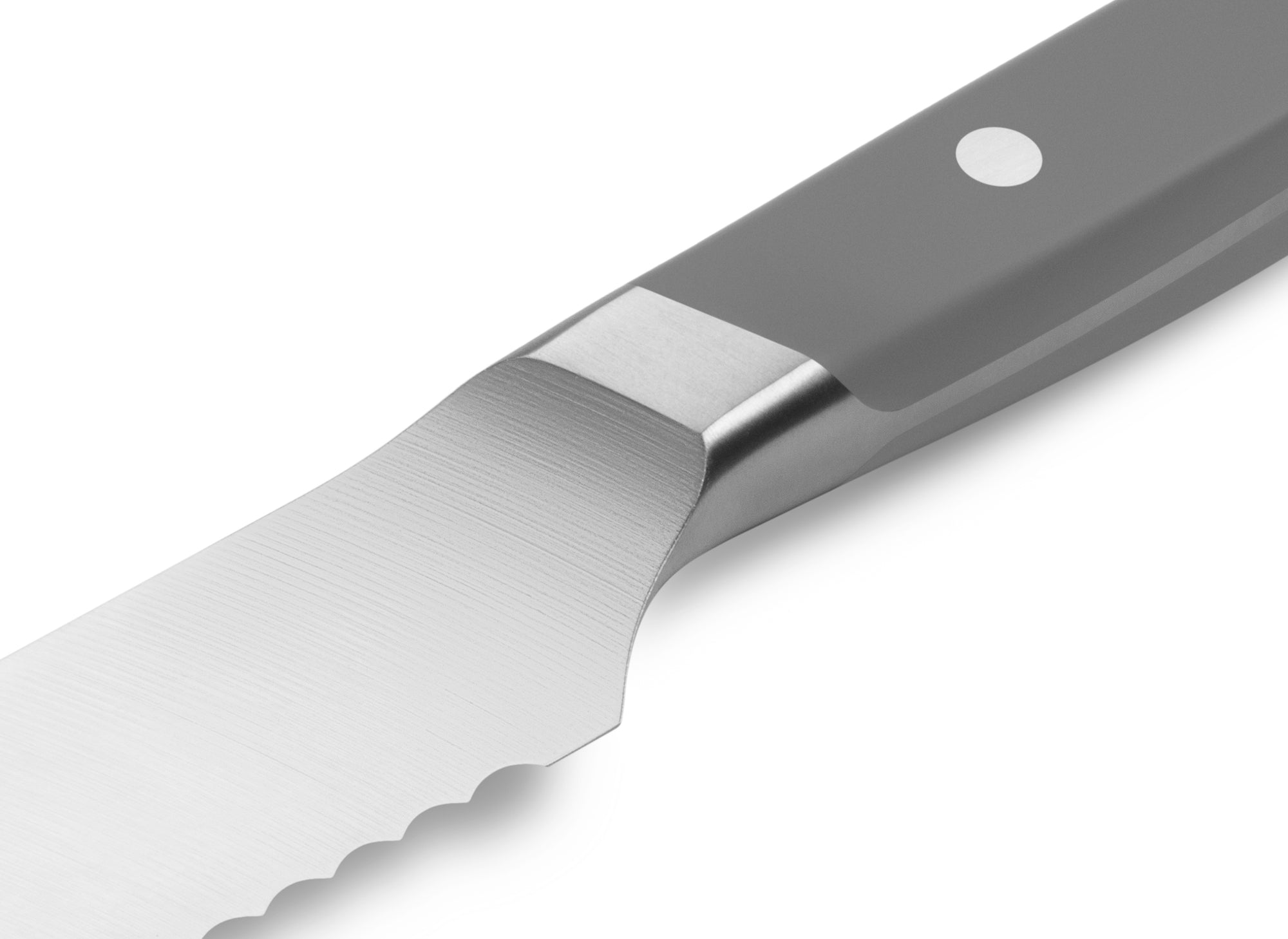 The Misen Serrated Knife in gray features a unique sloped bolster.