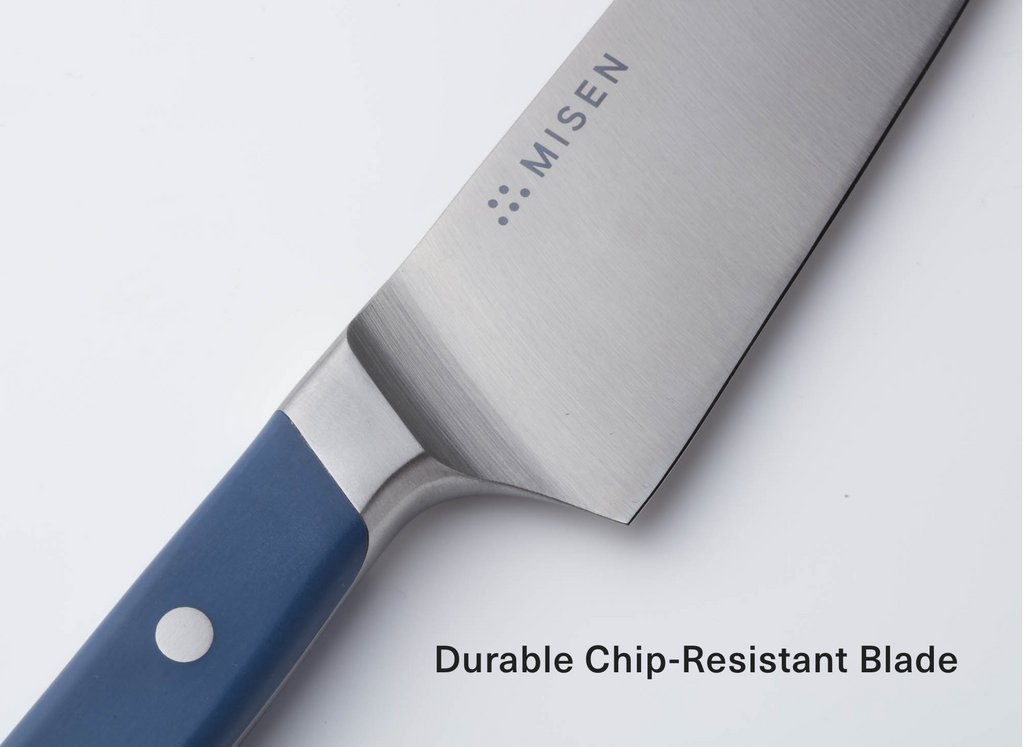 Misen stainless-steel chef's knife blade and blue handle with single rivet; text 'Durable Chip-Resistant Blade' visible