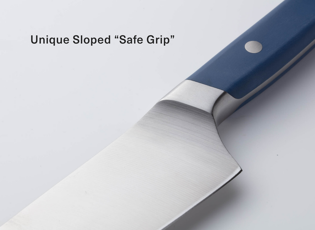 Close-up of stainless chef's knife blade and blue handle with sloped bolster; printed text 'Unique Sloped “Safe Grip”'.