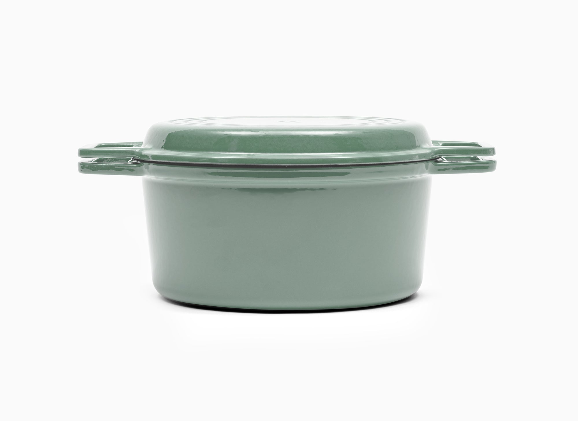 Green Misen Dutch Oven covered by Grill Lid.