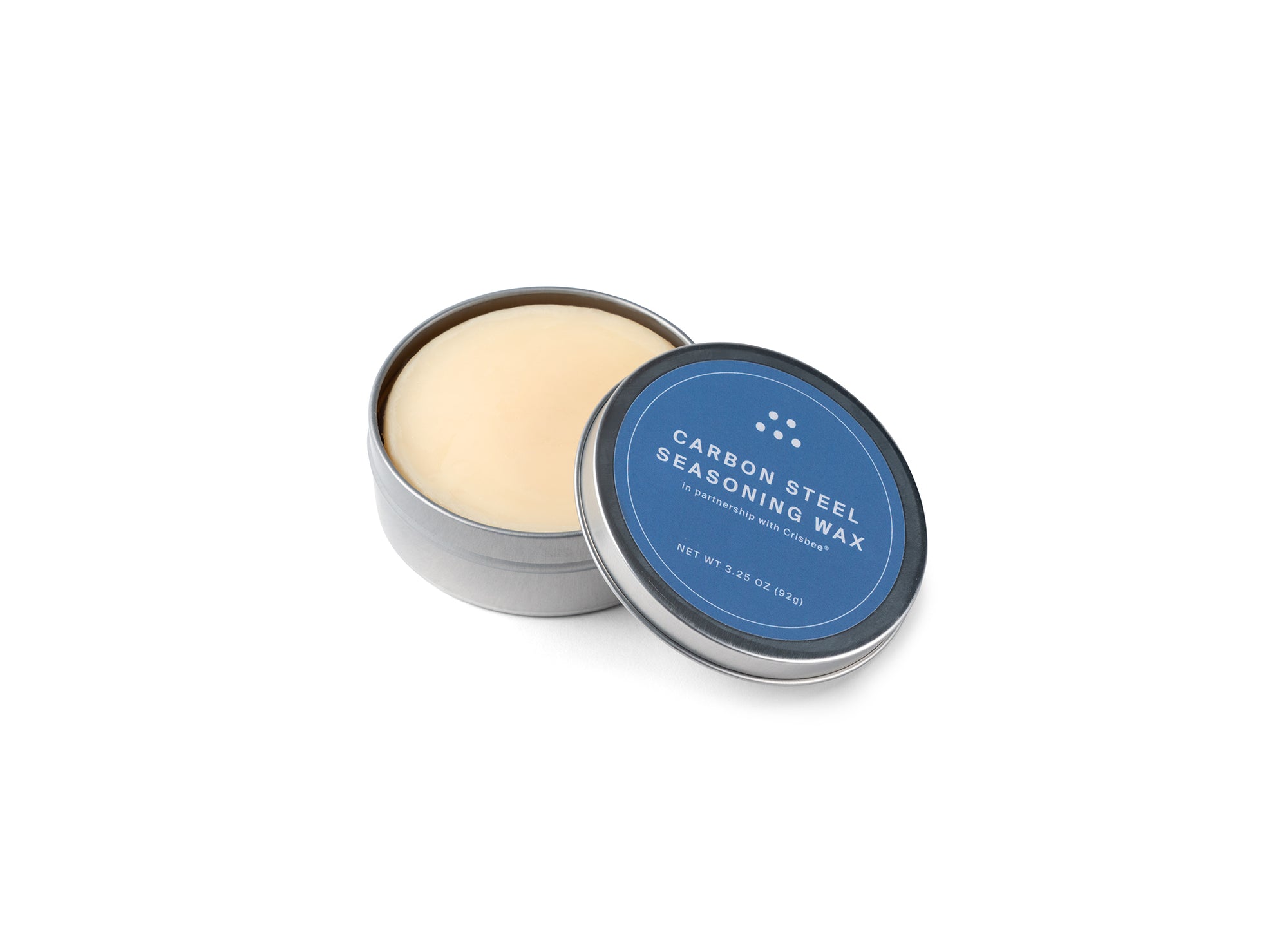 {{3-25-oz}} MIsen Carbon Steel Seasoning Wax tin with lid partially removed on a white background, showing a pale yellow wax puck.