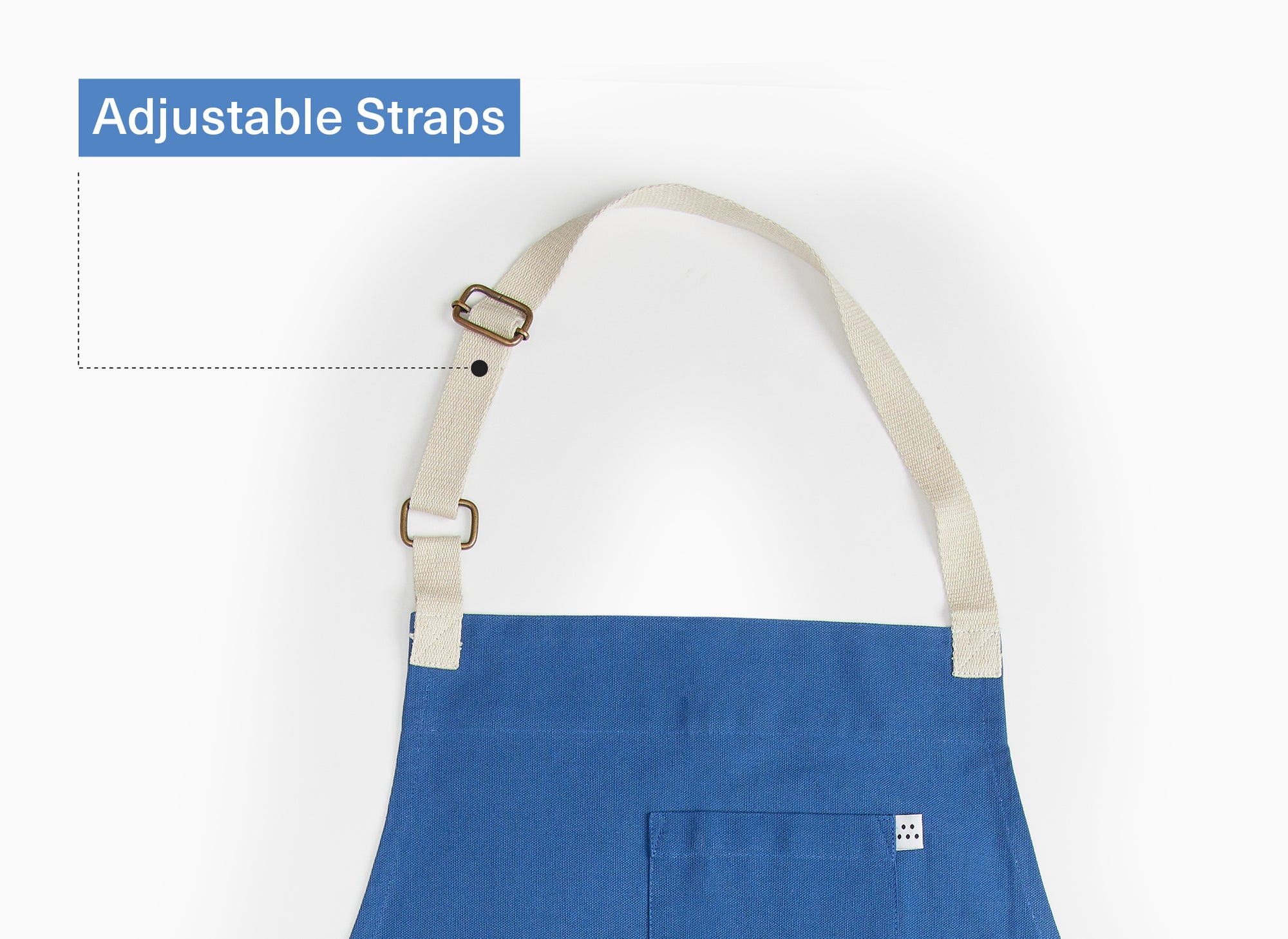 The top quarter of a blue Misen Apron lies flat on a white background. Graphics on the image say “Adjustable Straps.”