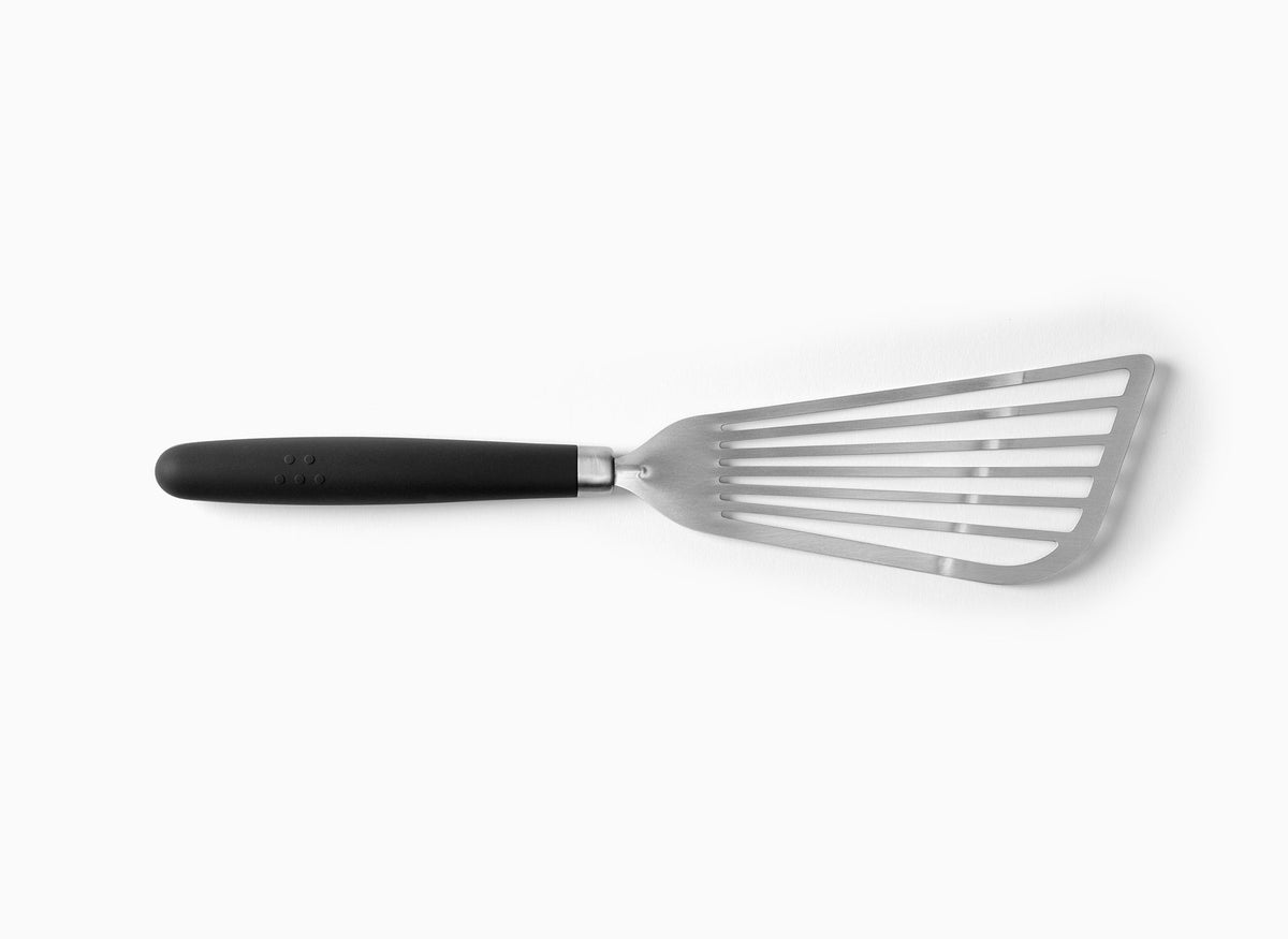 A Black Misen Metal Fish Spatula on a white background. Shows a slotted and flared metal head attached to a silicone handle.