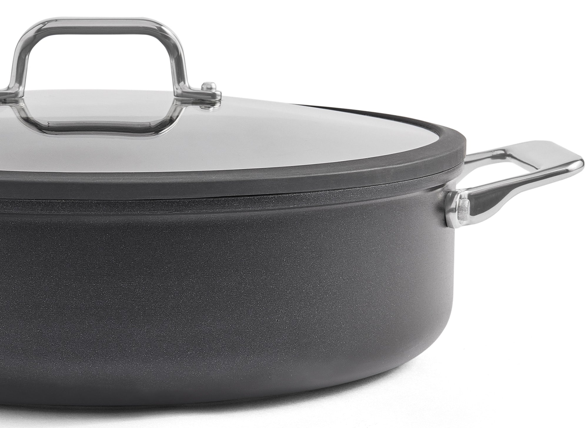 A front-facing, zoomed-in view of the Misen Nonstick Rondeau with lid on, on a white background. The right two-thirds of the pan are visible.