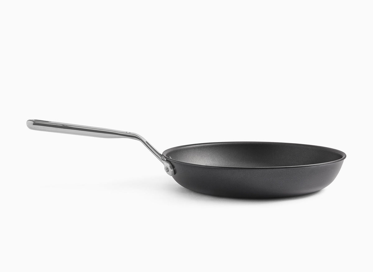 A side view of the 10-Inch Misen Nonstick Pan on a white background. 