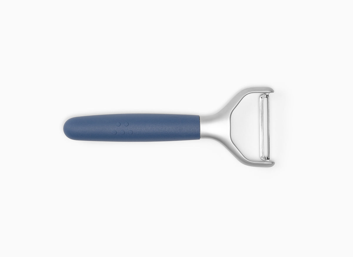 A Blue Misen Peeler with silicone handle and metal Y-shaped head viewed from above on a white background.